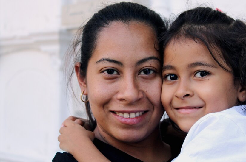Mother and child smiling